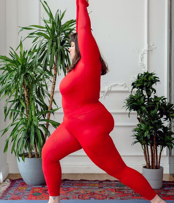 Athlete in a powerful yoga warrior pose, demonstrating strength and focus.